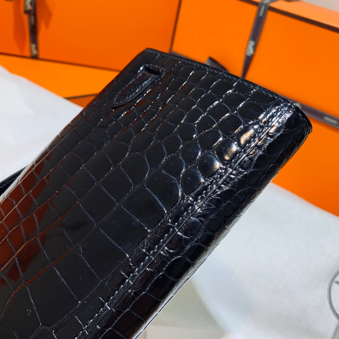 HERMES KELLY CUT 31 IN BLACK SHINY ALLIGATOR LEATHER WITH GOLD HARDWARE