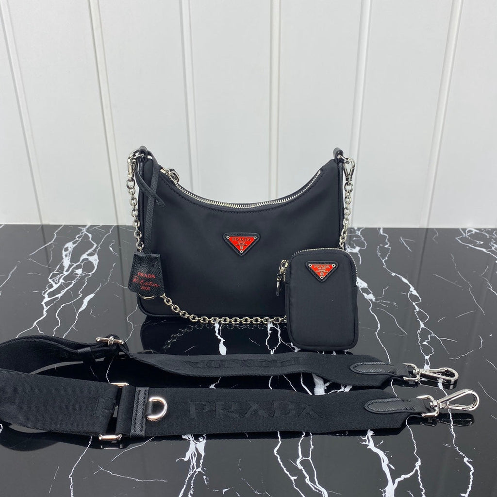 PRADA HOBO 22 BAG IN BLACK RE-NYLON WITH RED LOGO