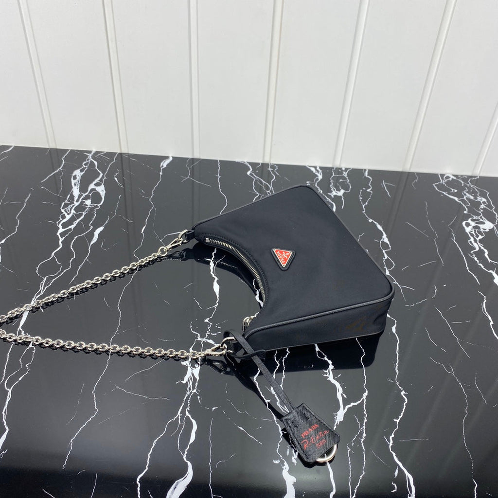 PRADA HOBO 22 BAG IN BLACK RE-NYLON WITH RED LOGO