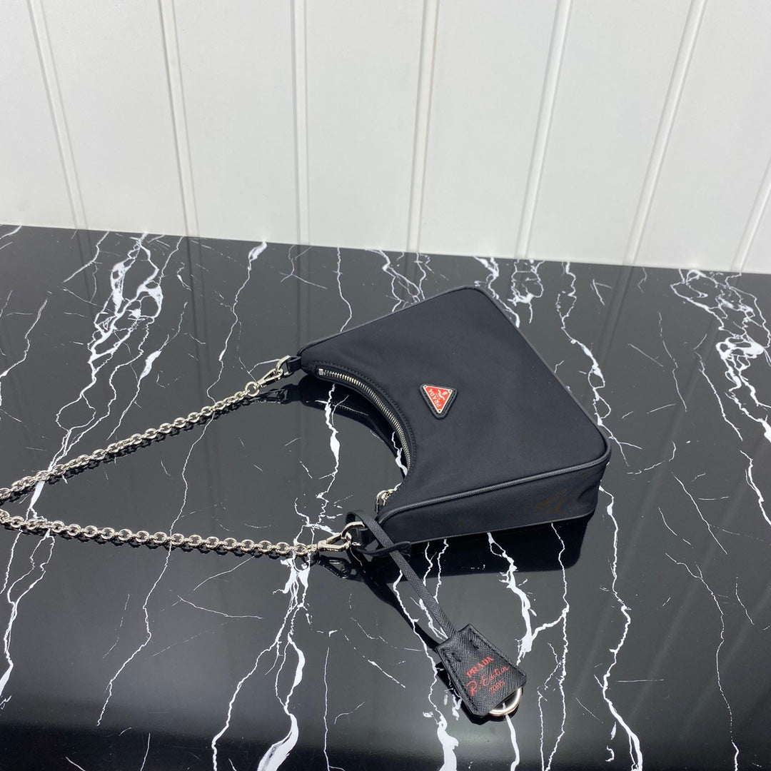 PRADA HOBO 22 BAG IN BLACK RE-NYLON WITH RED LOGO