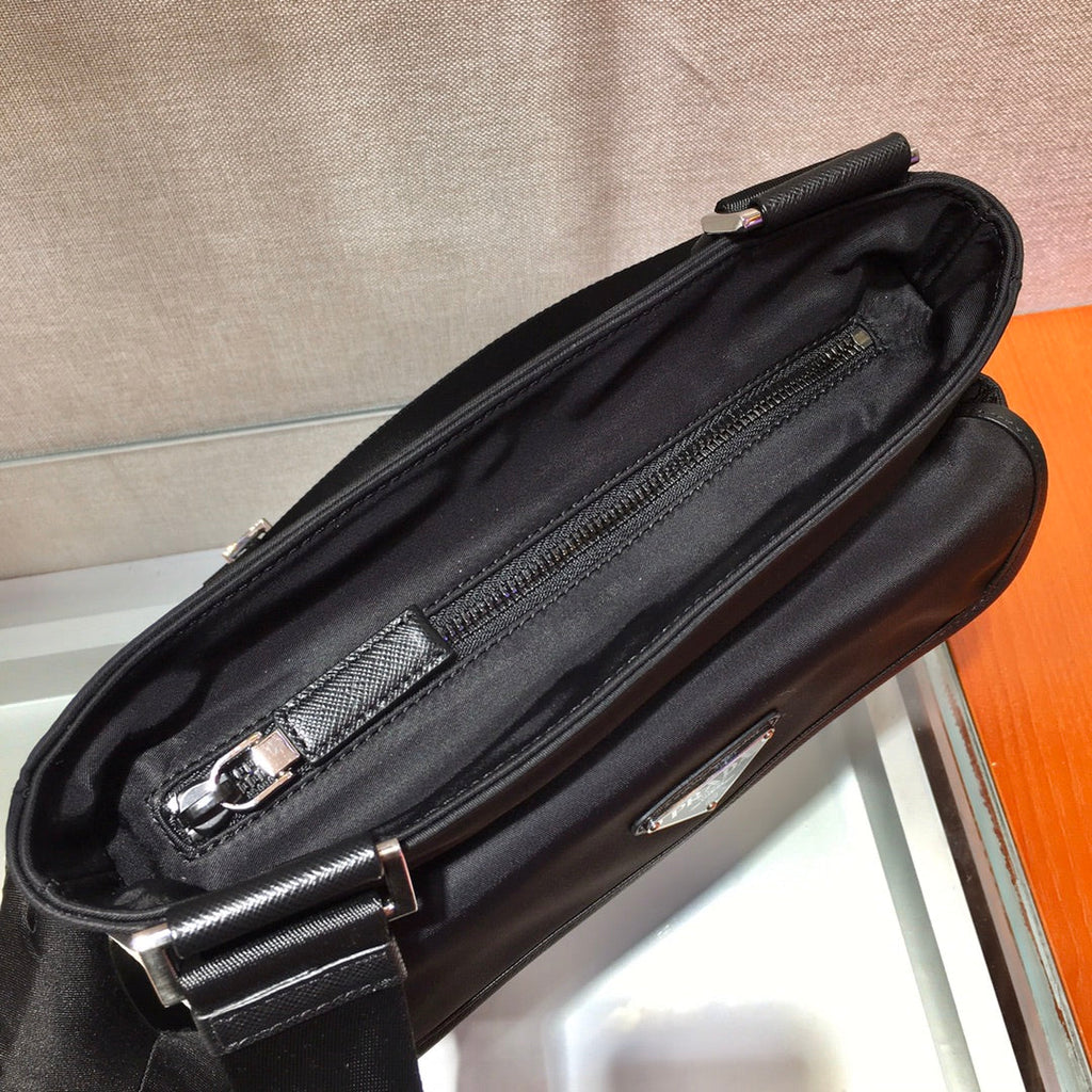 PRADA TRIANGLE LOGO CROSSBODY BAG 25 IN BLACK RE-NYLON AND SAFFIANO LEATHER TRIM