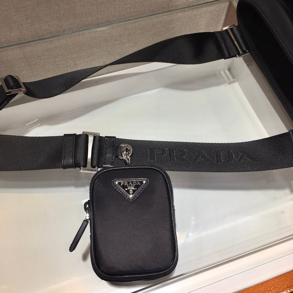 PRADA TRIANGLE LOGO CROSSBODY BAG 25 IN BLACK RE-NYLON AND SAFFIANO LEATHER TRIM