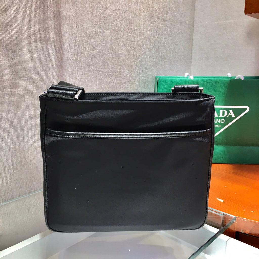 PRADA TRIANGLE LOGO CROSSBODY BAG 25 IN BLACK RE-NYLON AND SAFFIANO LEATHER TRIM