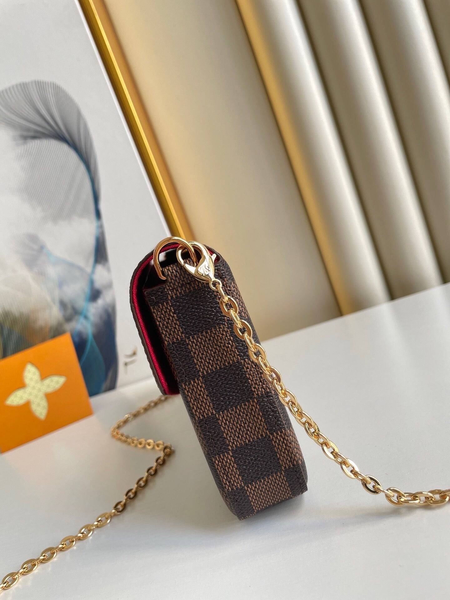 LOUIS VUITTON FÉLICIE POCHETTE 21 IN BROWN DAMIER EBENE COATED CANVAS GOLD HARDWARE