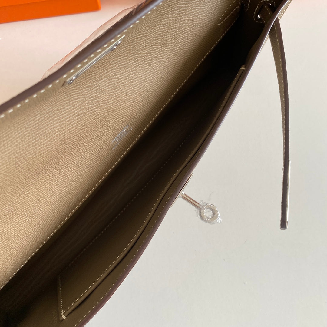 HERMES KELLY CUT 31 IN MOCHA BROWN CALFSKIN WITH SILVER HARDWARE