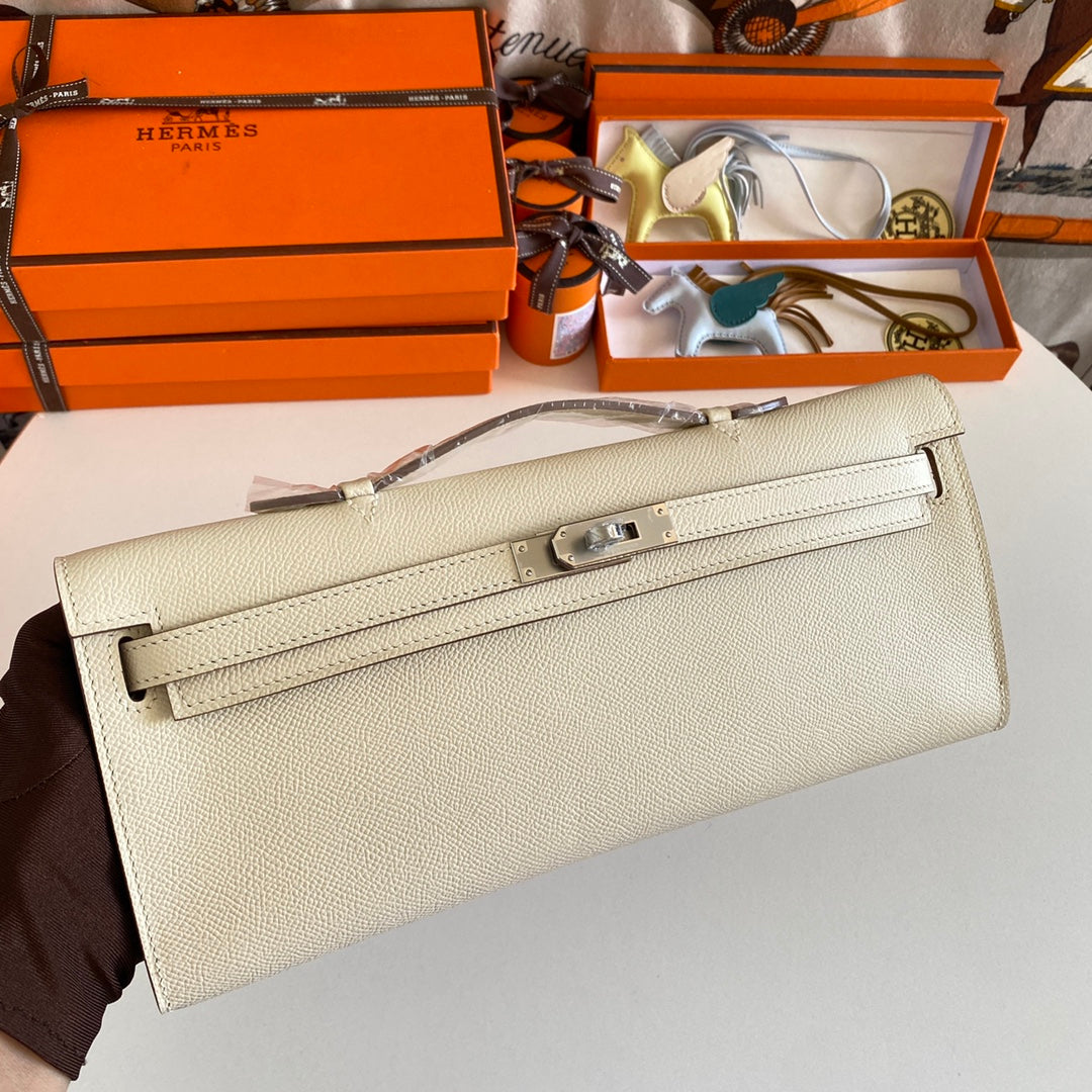 HERMES KELLY CUT 31 IN BEIGE CREAM CALFSKIN WITH SILVER HARDWARE