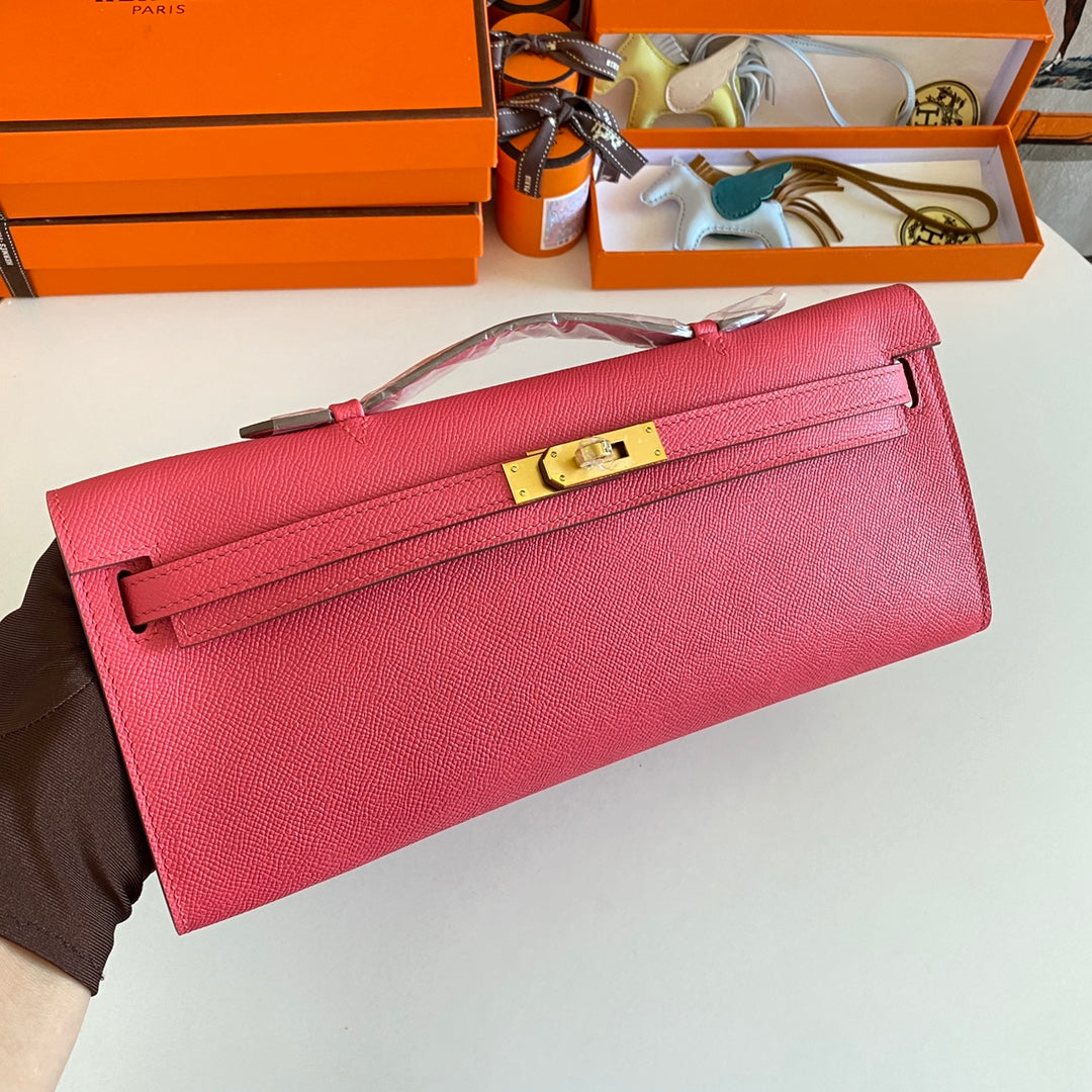 HERMES KELLY CUT 31 IN WATERMELON PINK CALFSKIN WITH GOLD HARDWARE