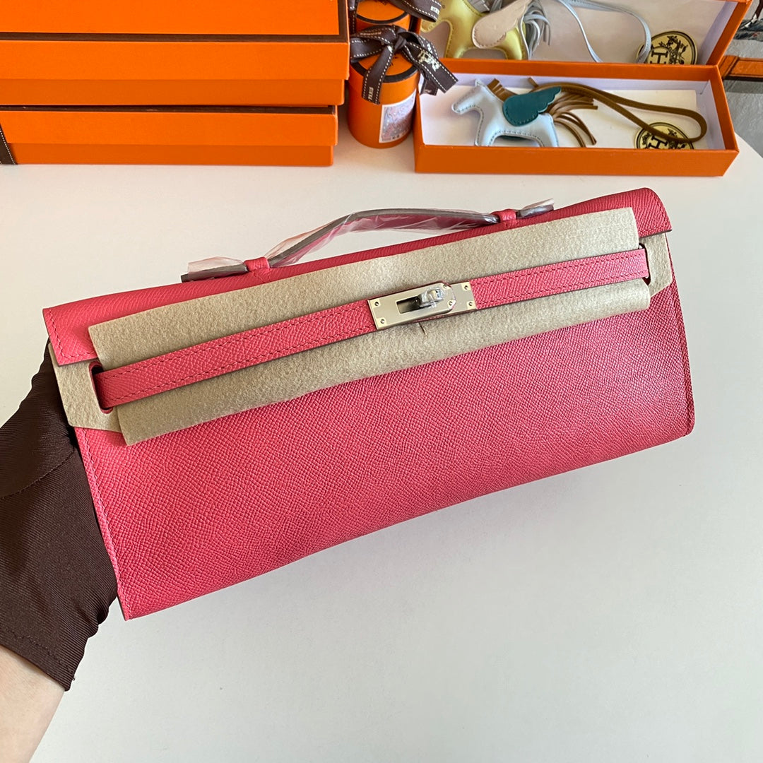 HERMES KELLY CUT 31 IN WATERMELON PINK CALFSKIN WITH SILVER HARDWARE
