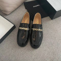 CHANEL MOASINS IN BLACK CALFSKIN GOLD METAL LOGO