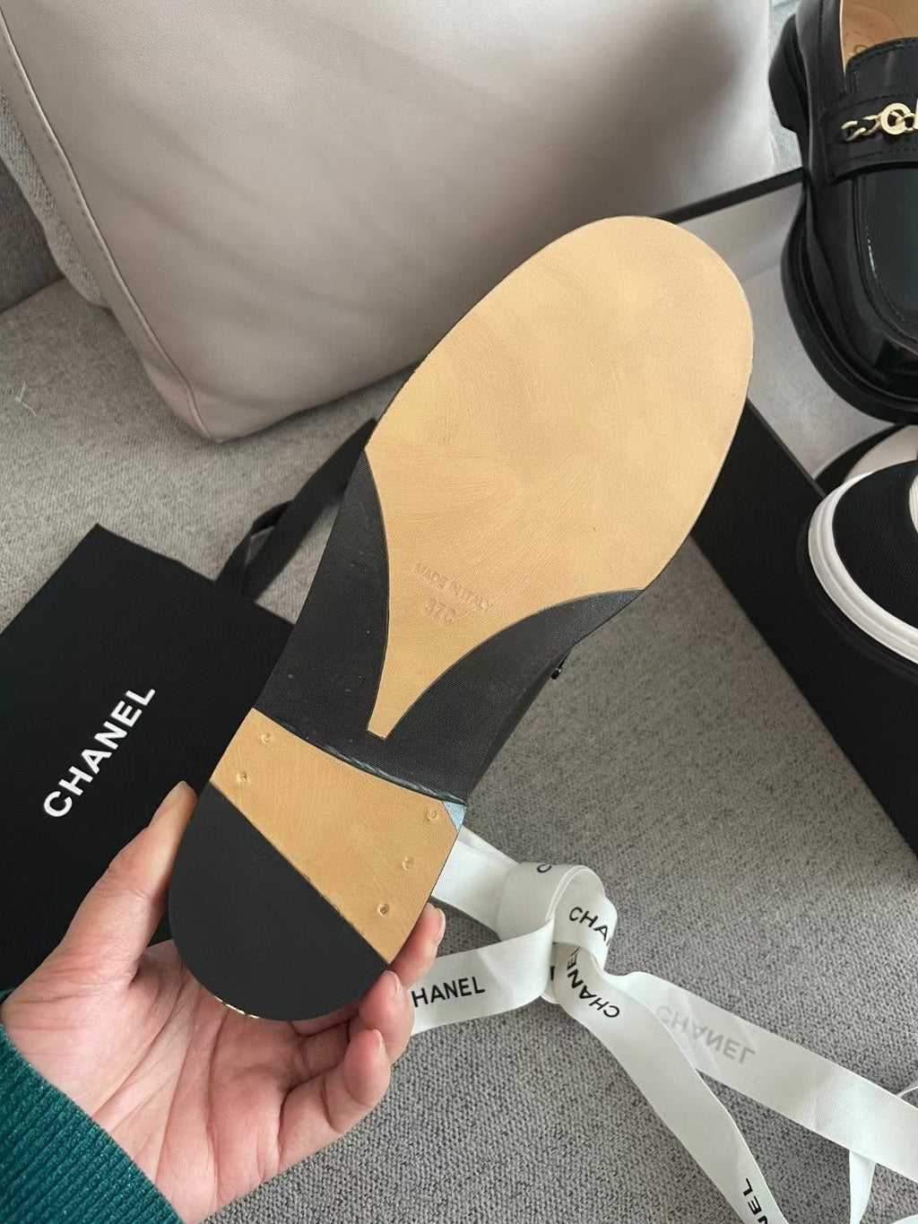 CHANEL MOASINS IN BLACK CALFSKIN GOLD METAL LOGO