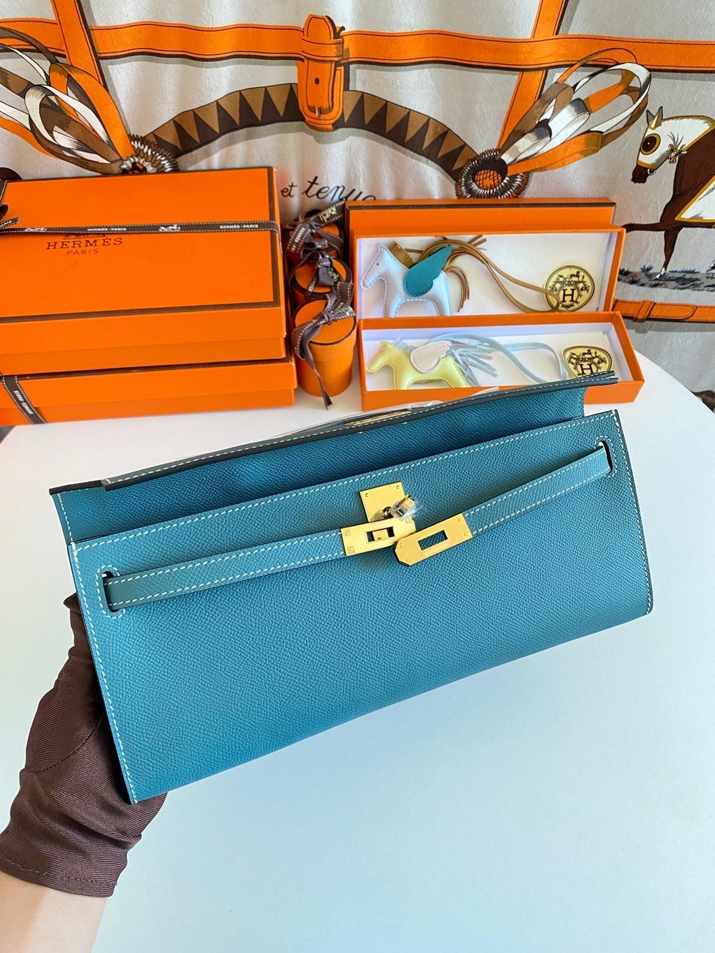 HERMES KELLY CUT 31 IN AZURE BLUE CALFSKIN WITH GOLD HARDWARE