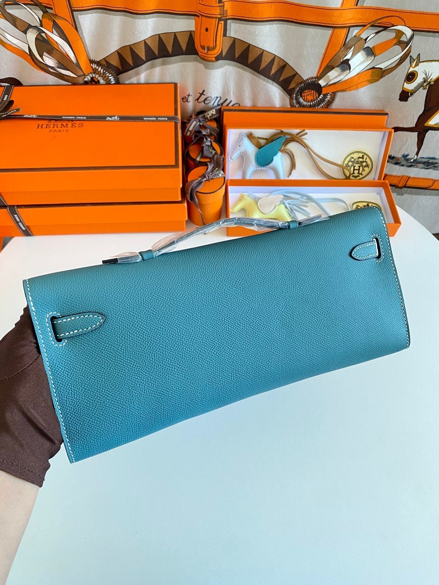 HERMES KELLY CUT 31 IN AZURE BLUE CALFSKIN WITH GOLD HARDWARE