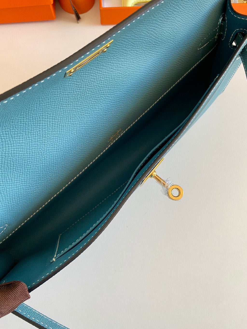 HERMES KELLY CUT 31 IN AZURE BLUE CALFSKIN WITH GOLD HARDWARE