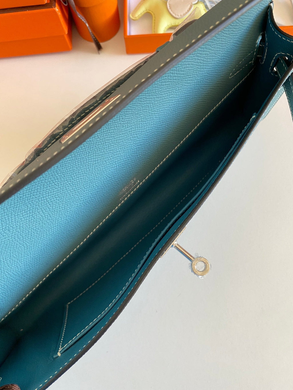 HERMES KELLY CUT 31 IN AZURE BLUE CALFSKIN WITH SILVER HARDWARE