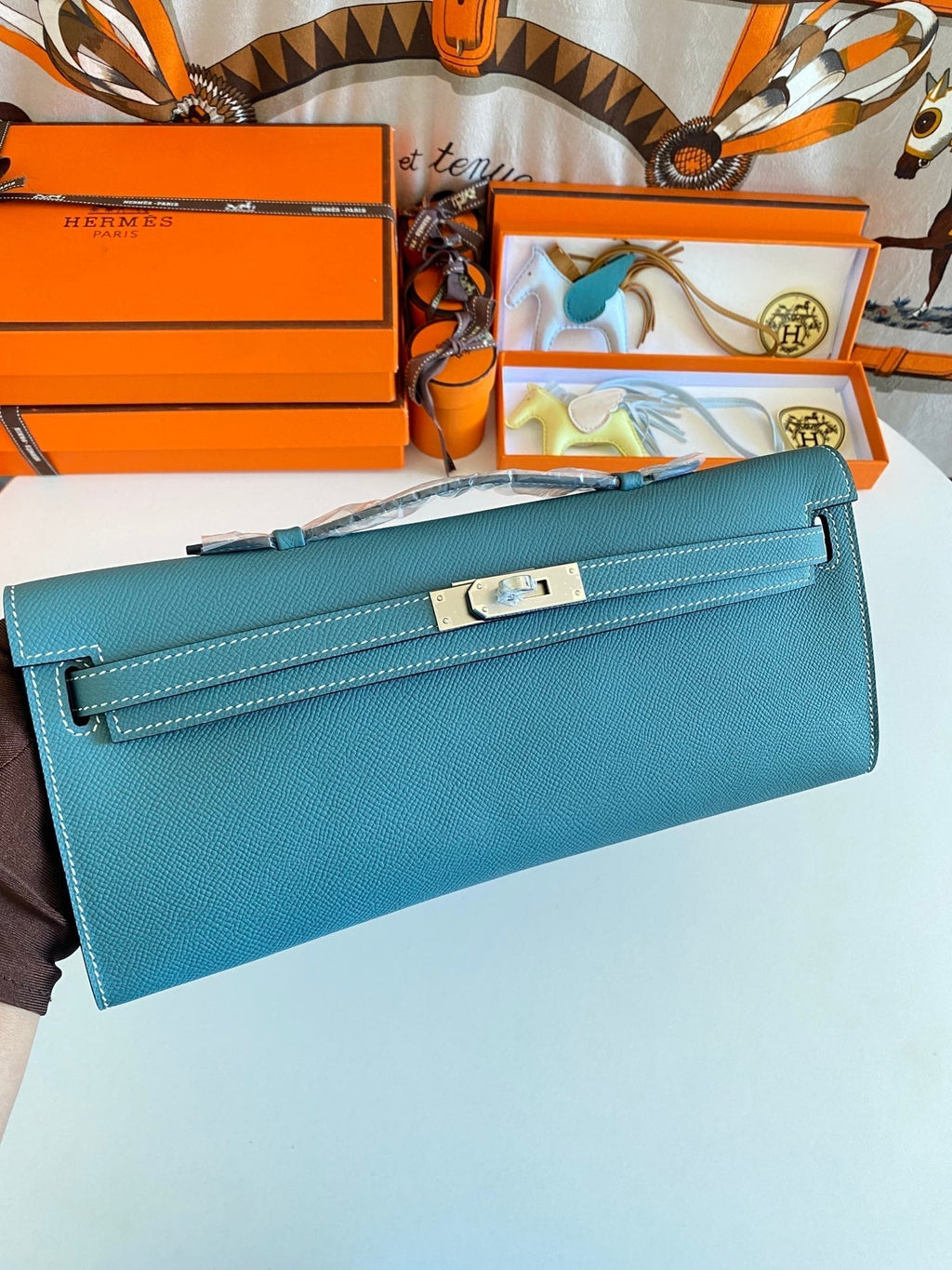 HERMES KELLY CUT 31 IN AZURE BLUE CALFSKIN WITH SILVER HARDWARE