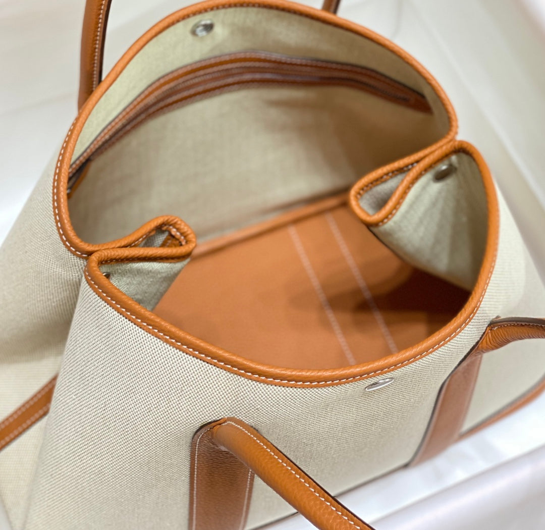 HERMES GARDEN PARTY 36CM IN WHITE TOILETS COTTON CANVAS AND BROWN CALFSKIN