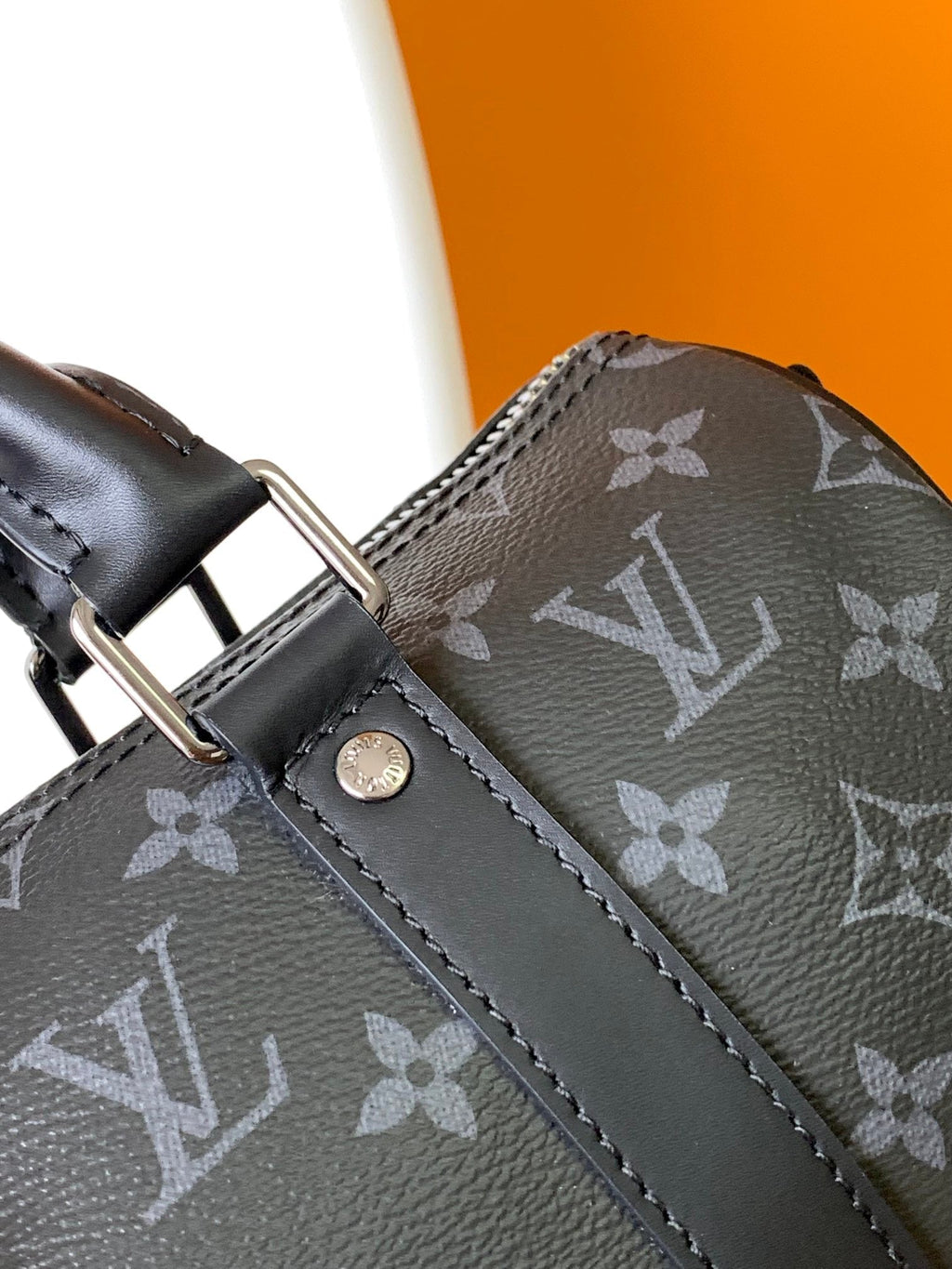 LOUIS VUITTON KEEPALL BANDOULIÈRE 25 IN BLACK MONOGRAM HERITAGE CANVAS