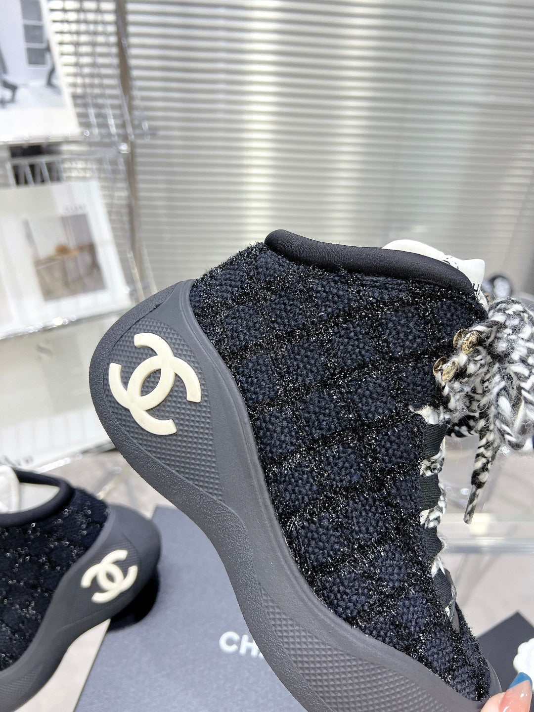 CHANEL CANO ALTO SNEAKER IN BLACK TWEED AND RUBBER