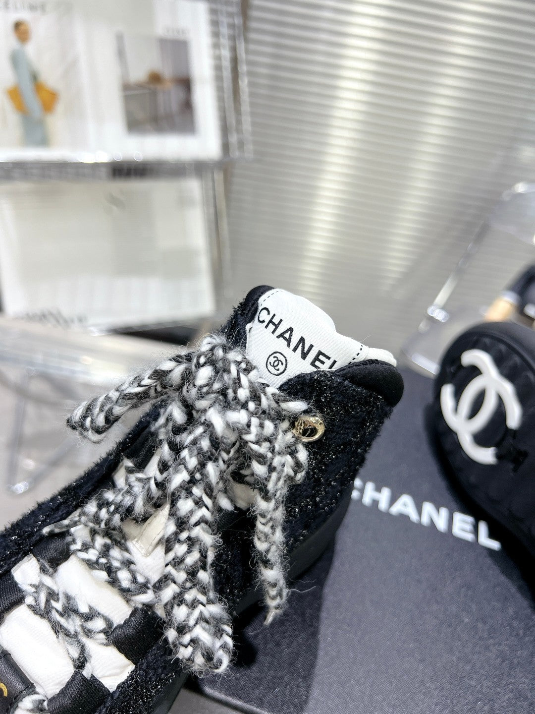 CHANEL CANO ALTO SNEAKER IN BLACK TWEED AND RUBBER