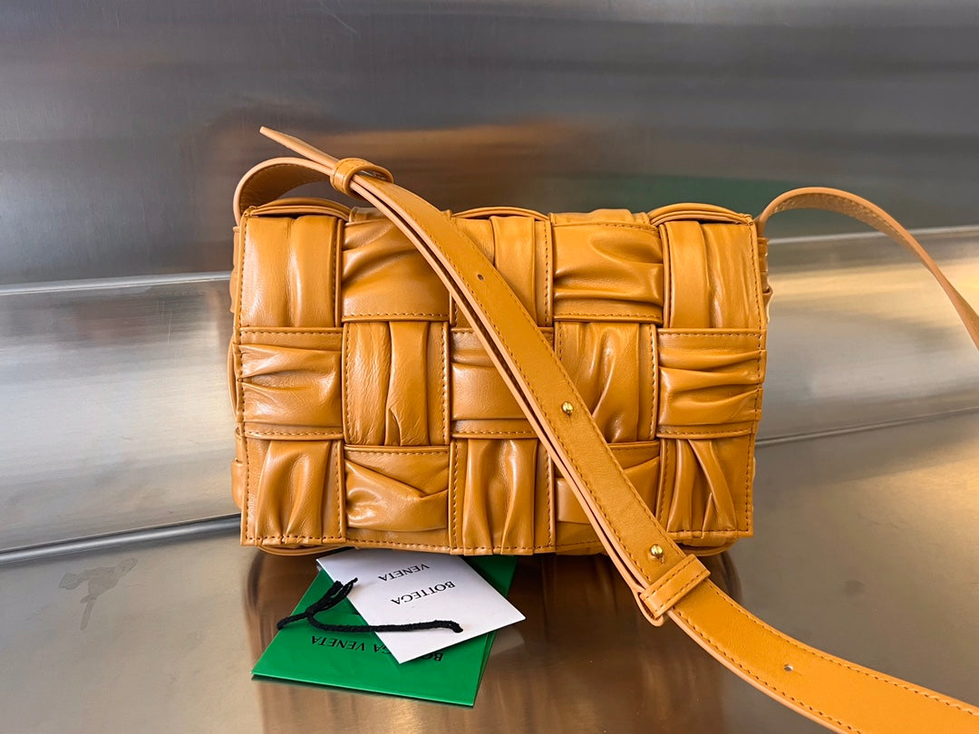 BOTTEGA VENETA CASSETTE 28 IN SANDSTONE ORANGE SOFT LAMBSKIN