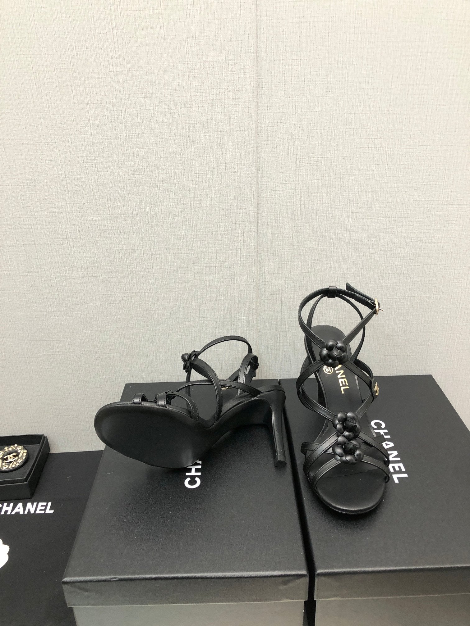 CHANEL FLORAL HIGH HEEL SANDAL IN BLACK LAMBSKIN