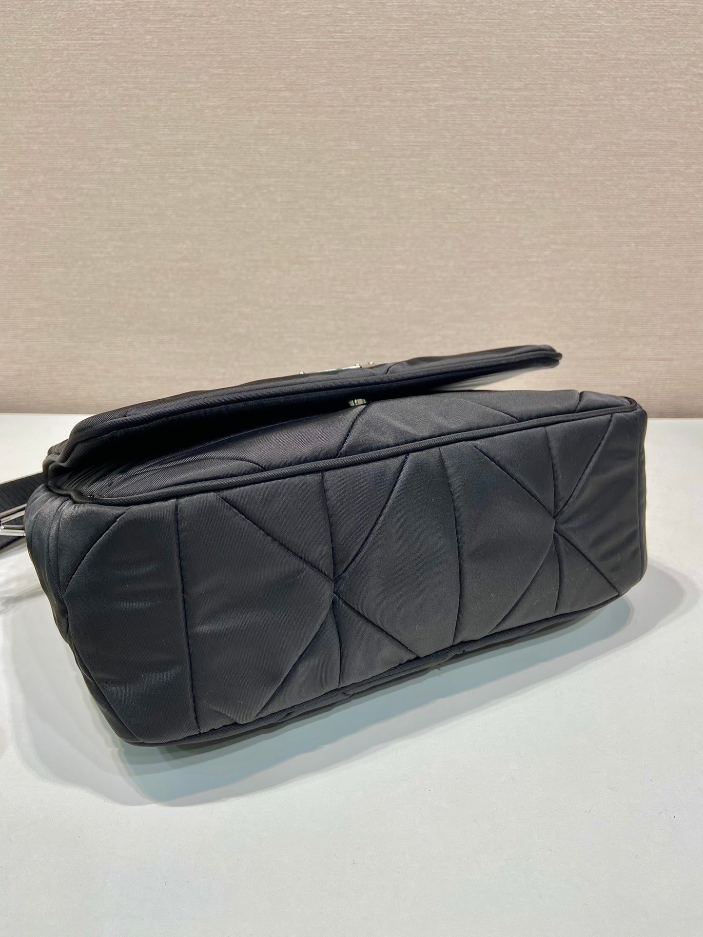 PRADA MEDIUM FLAP BAG 24 IN BLACK TRIANGULAR QUILTED PATTERN RE-NYLON