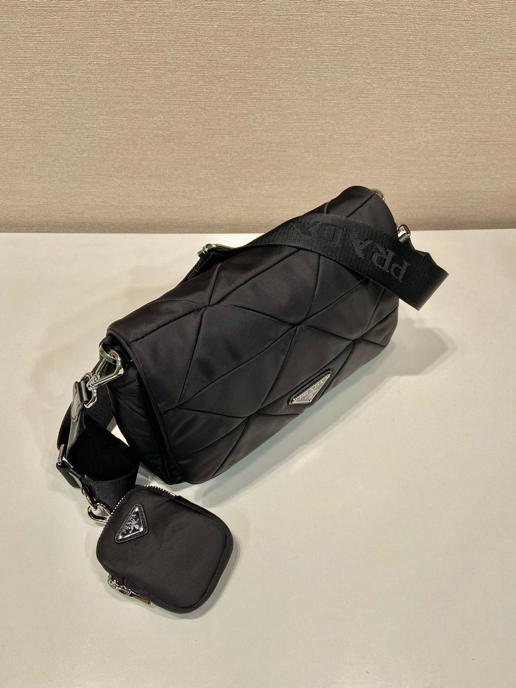 PRADA MEDIUM FLAP BAG 24 IN BLACK TRIANGULAR QUILTED PATTERN RE-NYLON