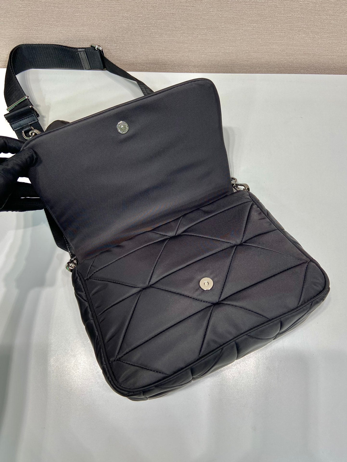 PRADA MEDIUM FLAP BAG 24 IN BLACK TRIANGULAR QUILTED PATTERN RE-NYLON