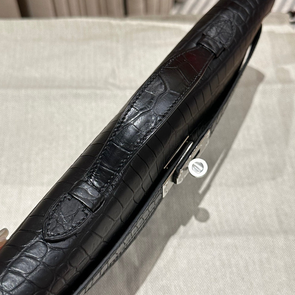 HERMES KELLY CUT 31 IN BLACK SHINY ALLIGATOR LEATHER WITH SILVER HARDWARE