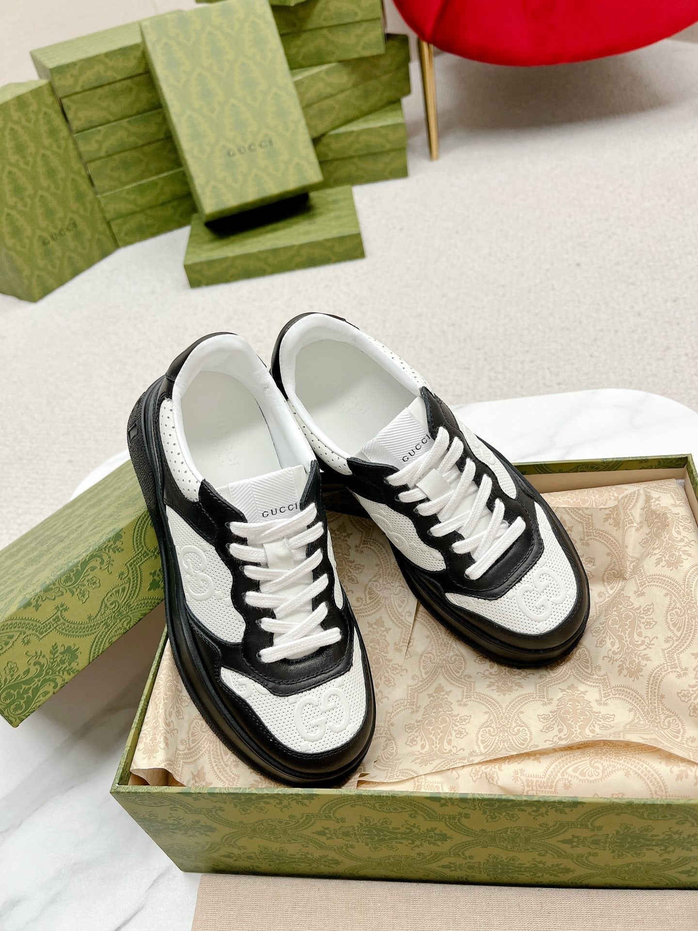 GUCCI EMBOSSED TRAINER BLACK AND WHITE CALFSKIN