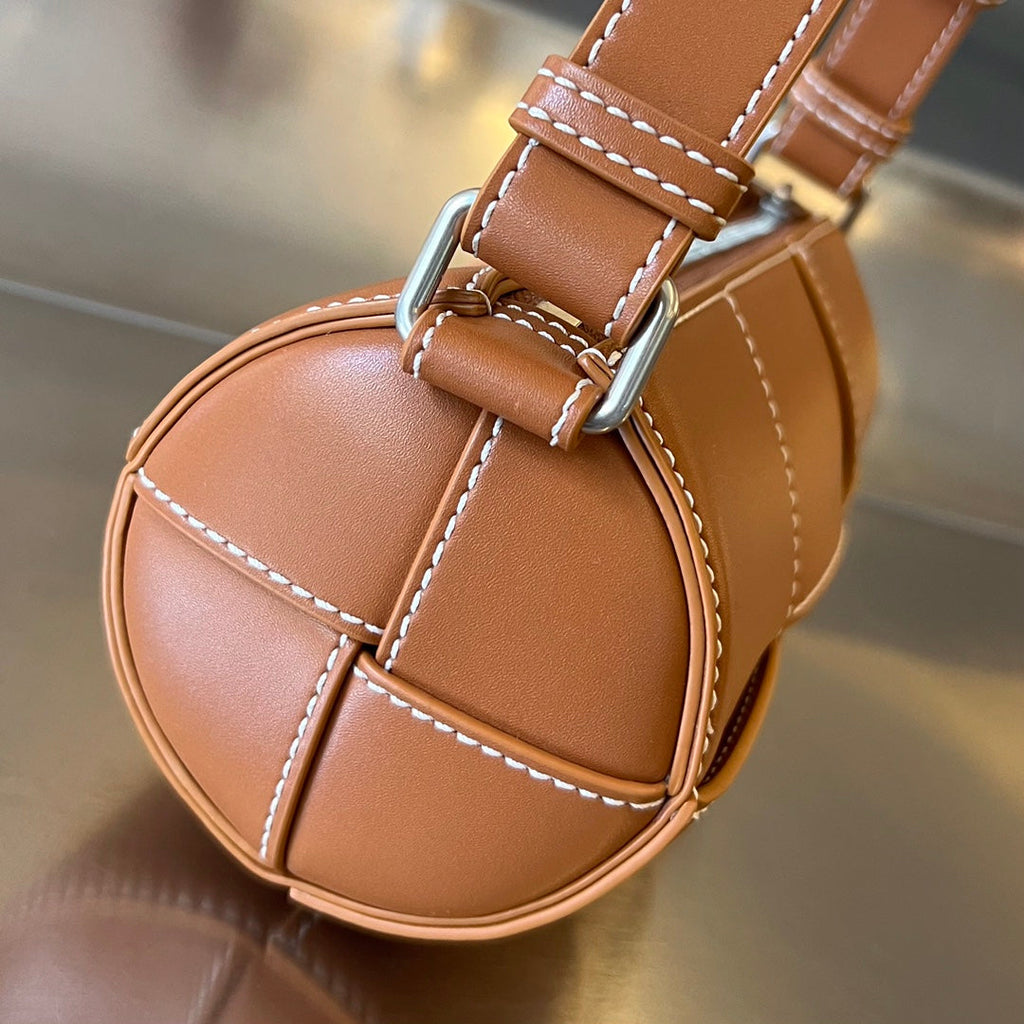 BOTTEGA VENETA SMALL CYLINDER CASSETTE 21 IN RAW SIENNA CALFSKIN