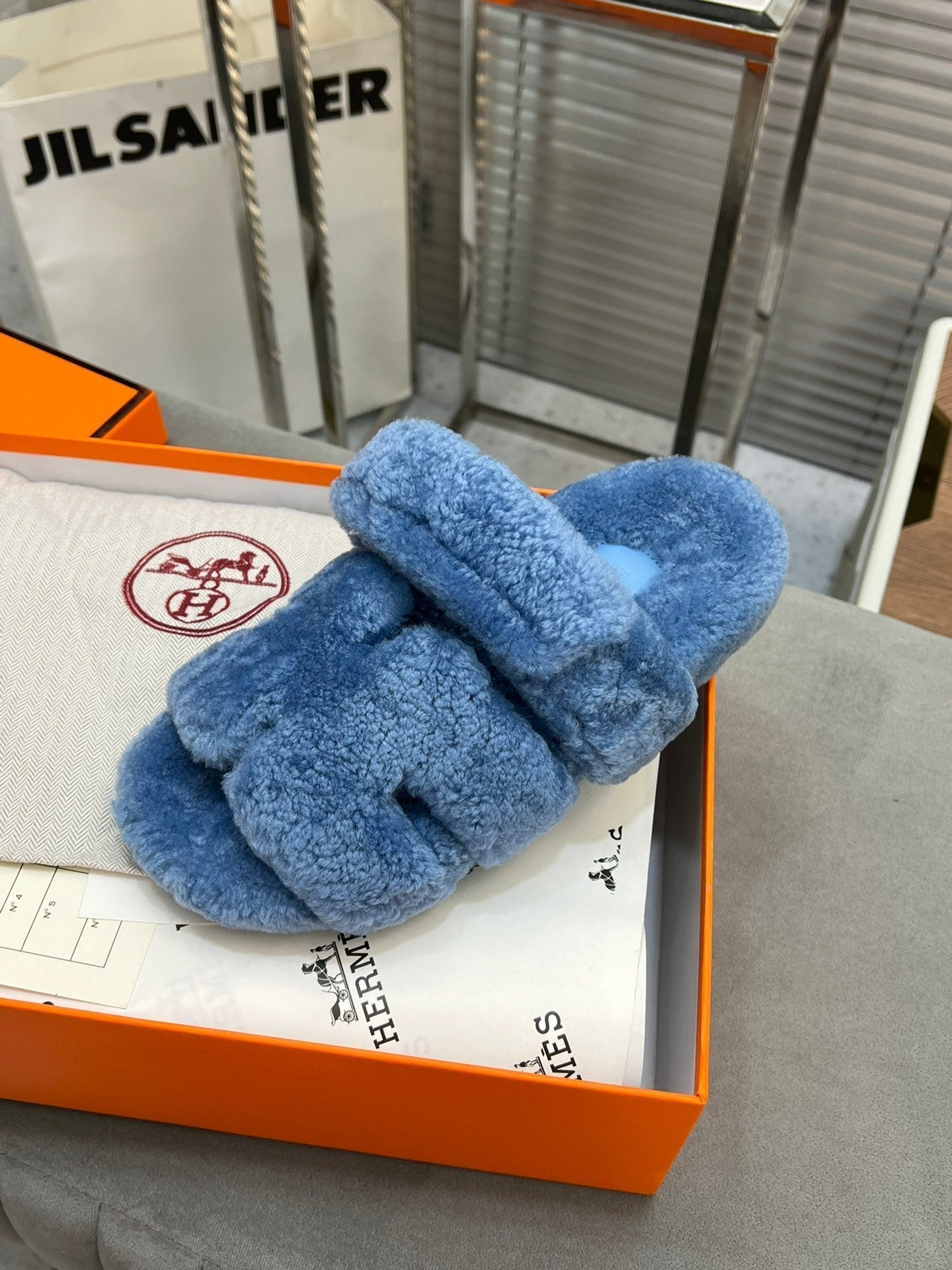 HERMES CHYPRE SLIPPERS IN AZURE BLUE LAMB WOOL