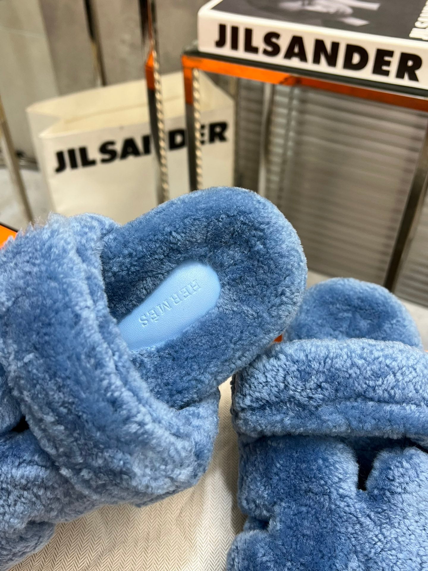 HERMES CHYPRE SLIPPERS IN AZURE BLUE LAMB WOOL