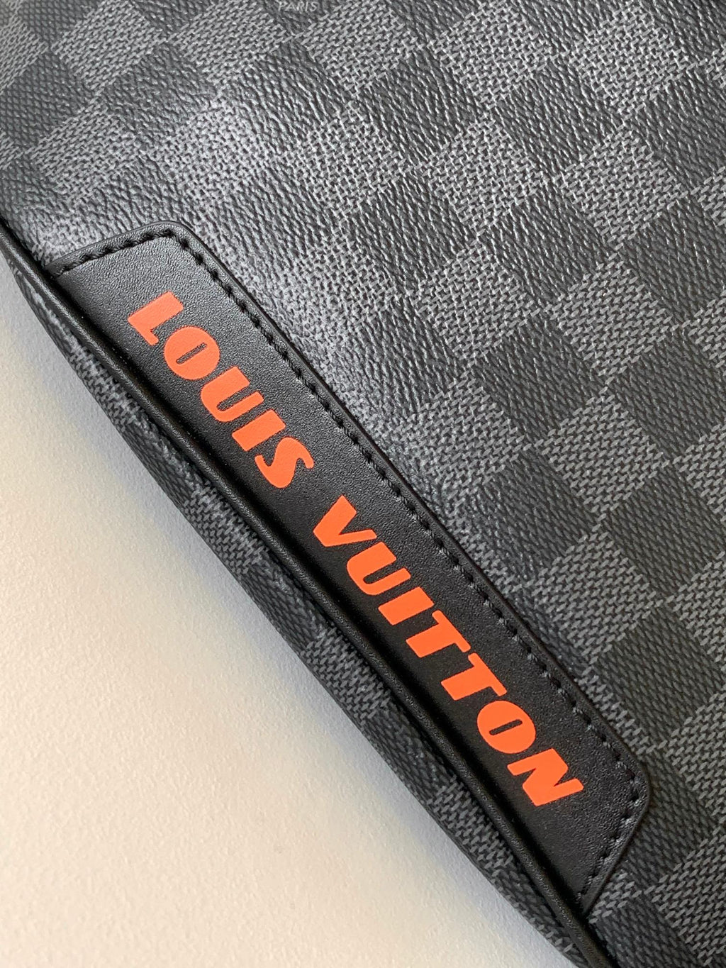 LOUIS VUITTON LV 25S BUMBAG 37 IN BLACK AND ORANGE COATED MONOGRAM CALFSKIN
