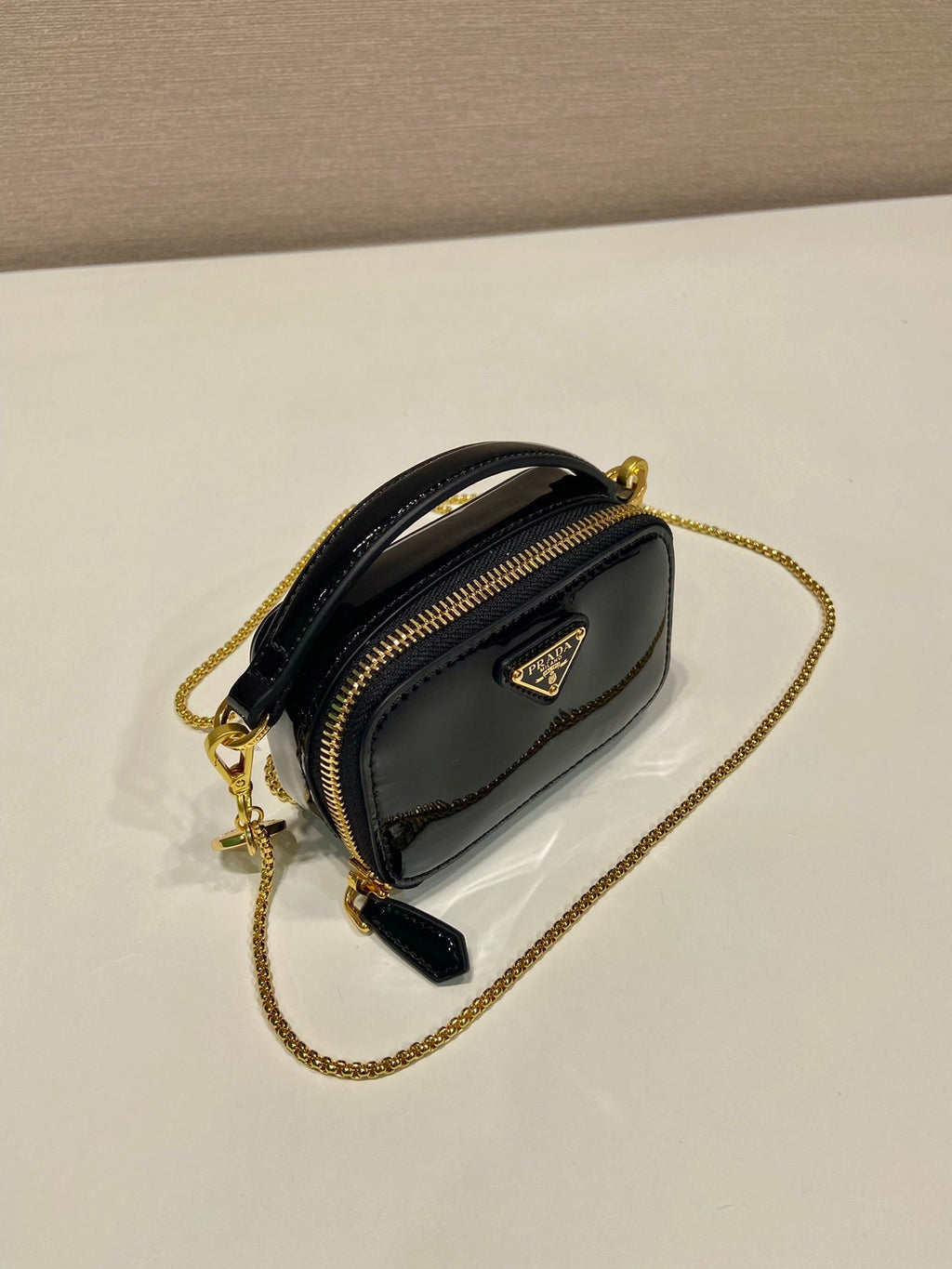 PRADA MINI HAND BAG 11 WITH GOLD STRAP IN BLACK PATENT CALFSKIN