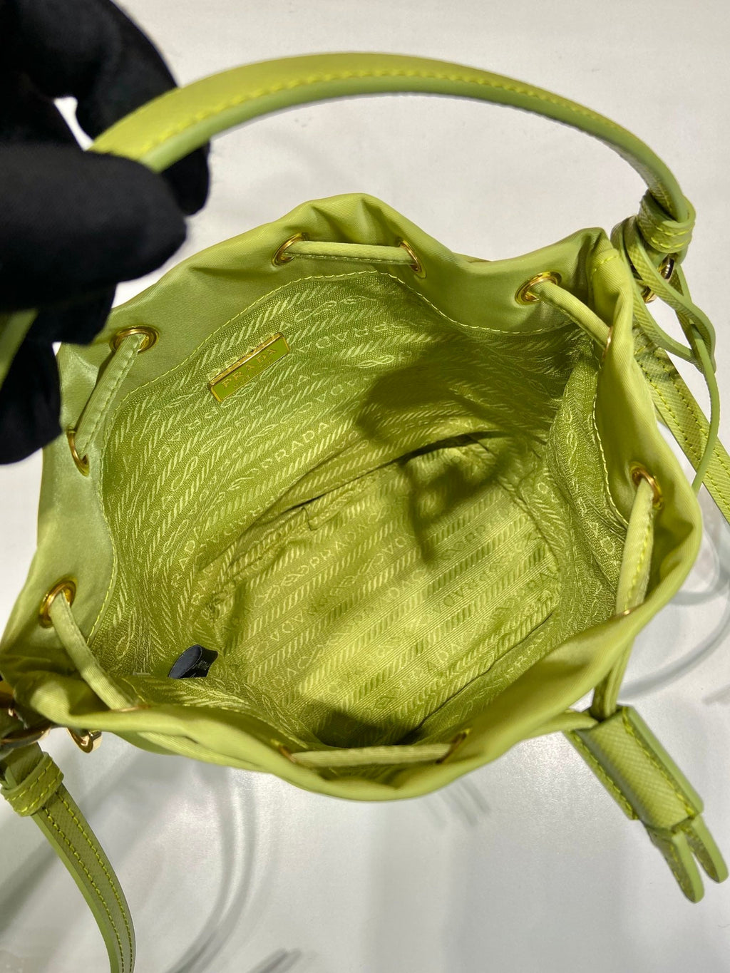 PRADA BUCKET BAG 19 IN APPLE GREEN RE-NYLON AND SAFFIANO LEATHER HANDLE