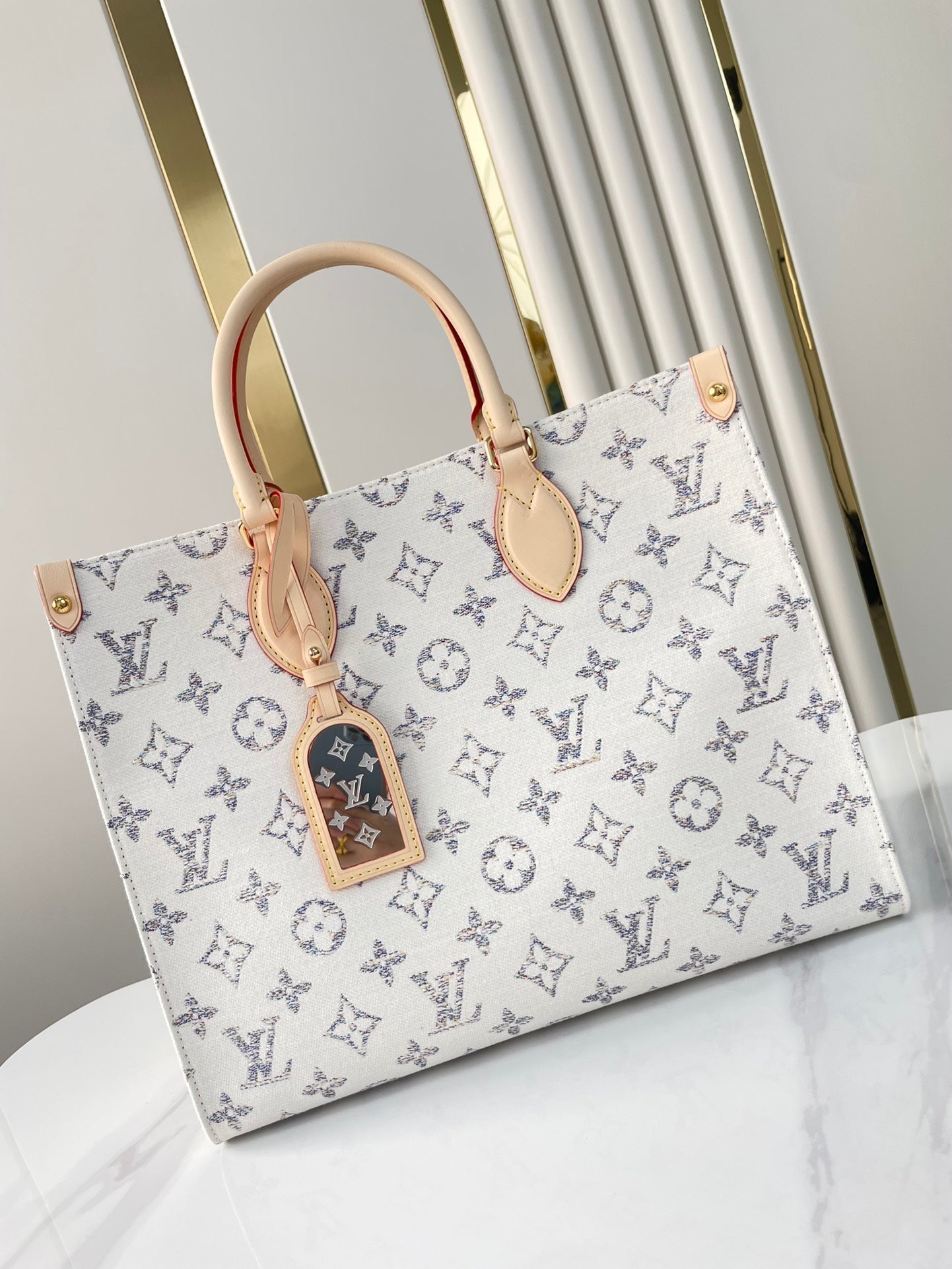 LOUIS VUITTON ONTHEGO MM 35 IN WHITE MONOGRAM JACQUARD FABRIC