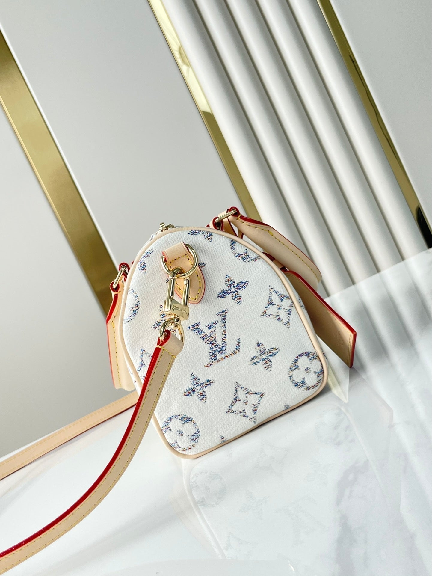 LOUIS VUITTON SPEEDY BANDOULIÈRE 20 IN WHITE MONOGRAM JACQUARD FABRIC AND BEIGE CALFSKIN TRIM