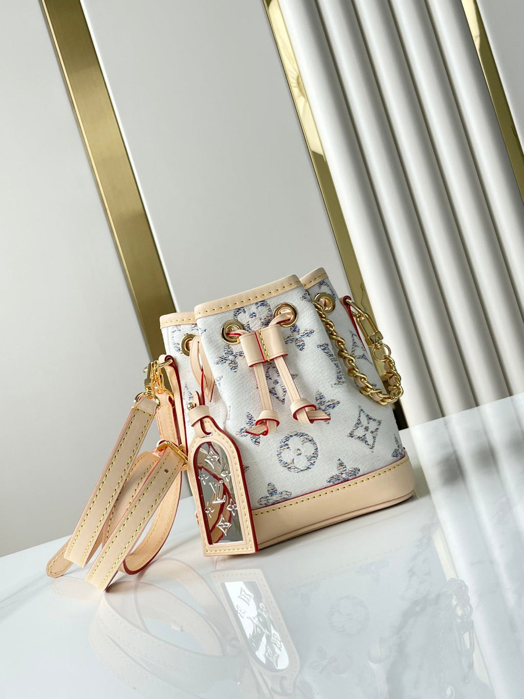 LOUIS VUITTON NANO NOÉ 16 IN WHITE MONOGRAM JACQUARD FABRIC AND BEIGE CALFSKIN TRIM