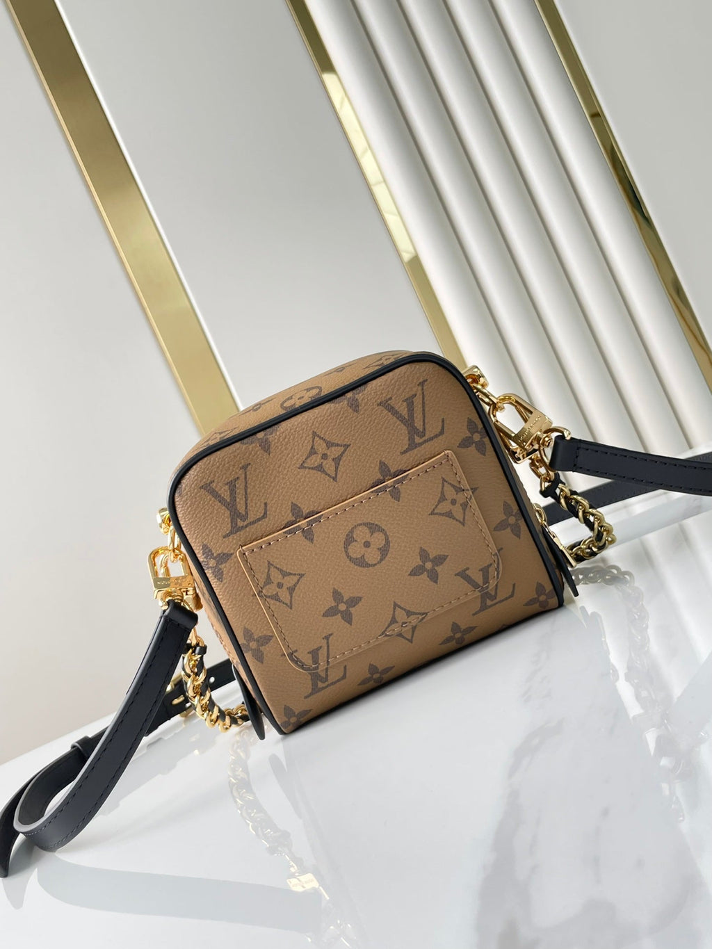 LOUIS VUITTON JUST IN CASE 14 IN BROWN MONOGRAM REVERSE CANVAS GOLD HARDWARE