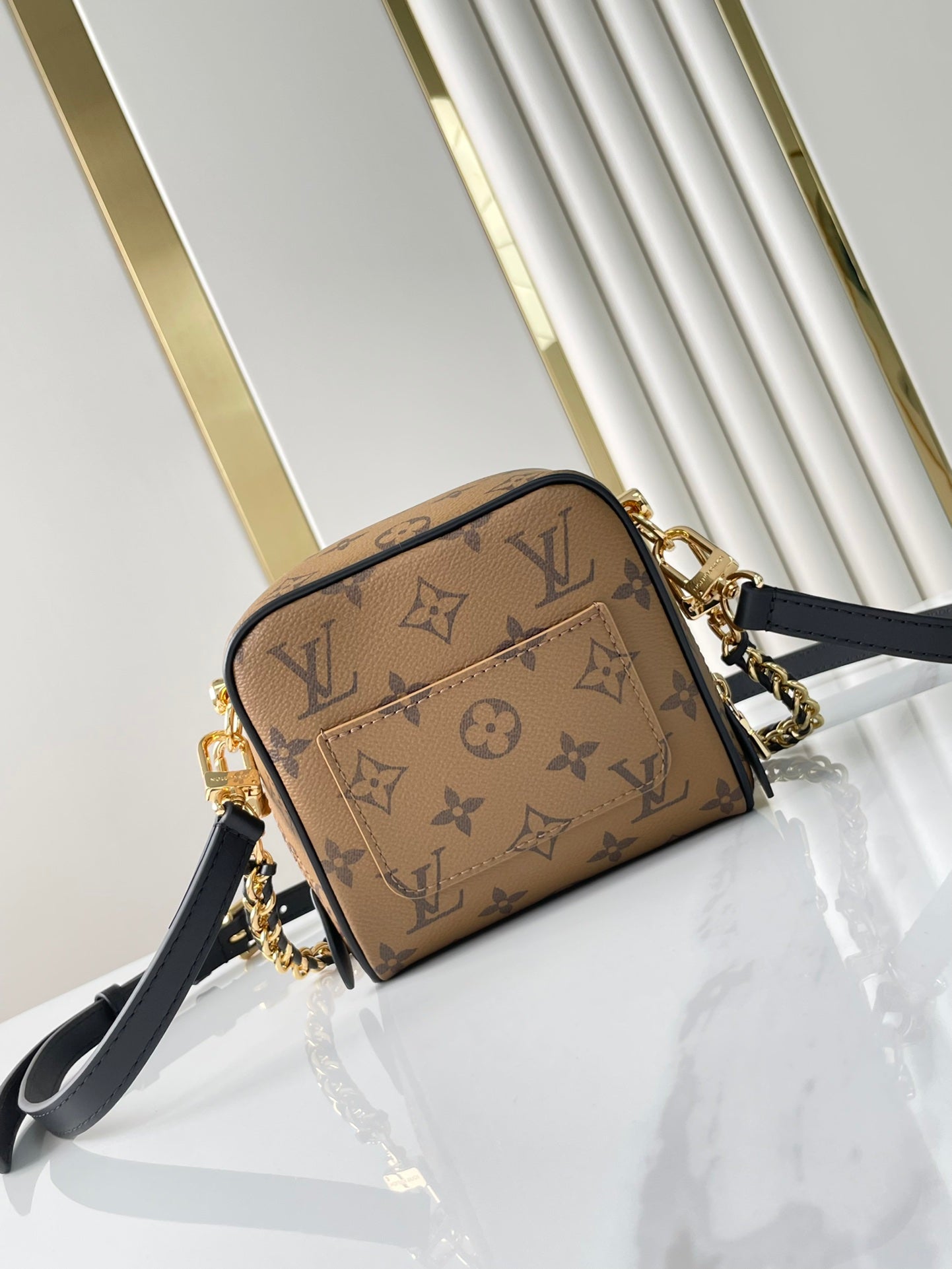LOUIS VUITTON JUST IN CASE 14 IN BROWN MONOGRAM REVERSE CANVAS GOLD HARDWARE