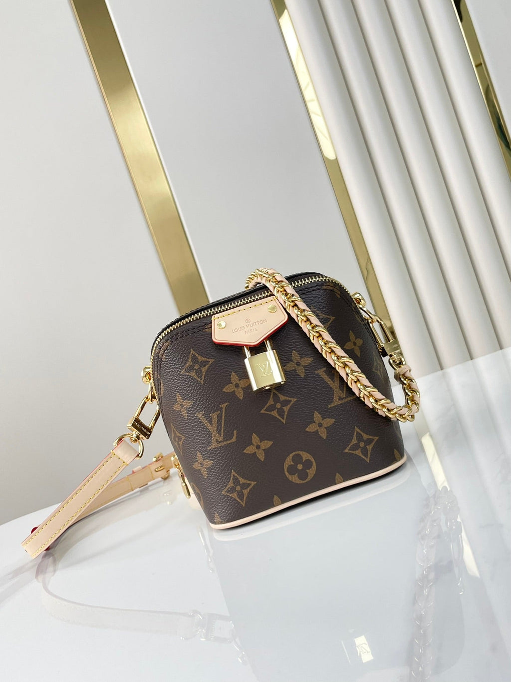 LOUIS VUITTON JUST IN CASE 14 IN BROWN MONOGRAM CANVAS GOLD HARDWARE