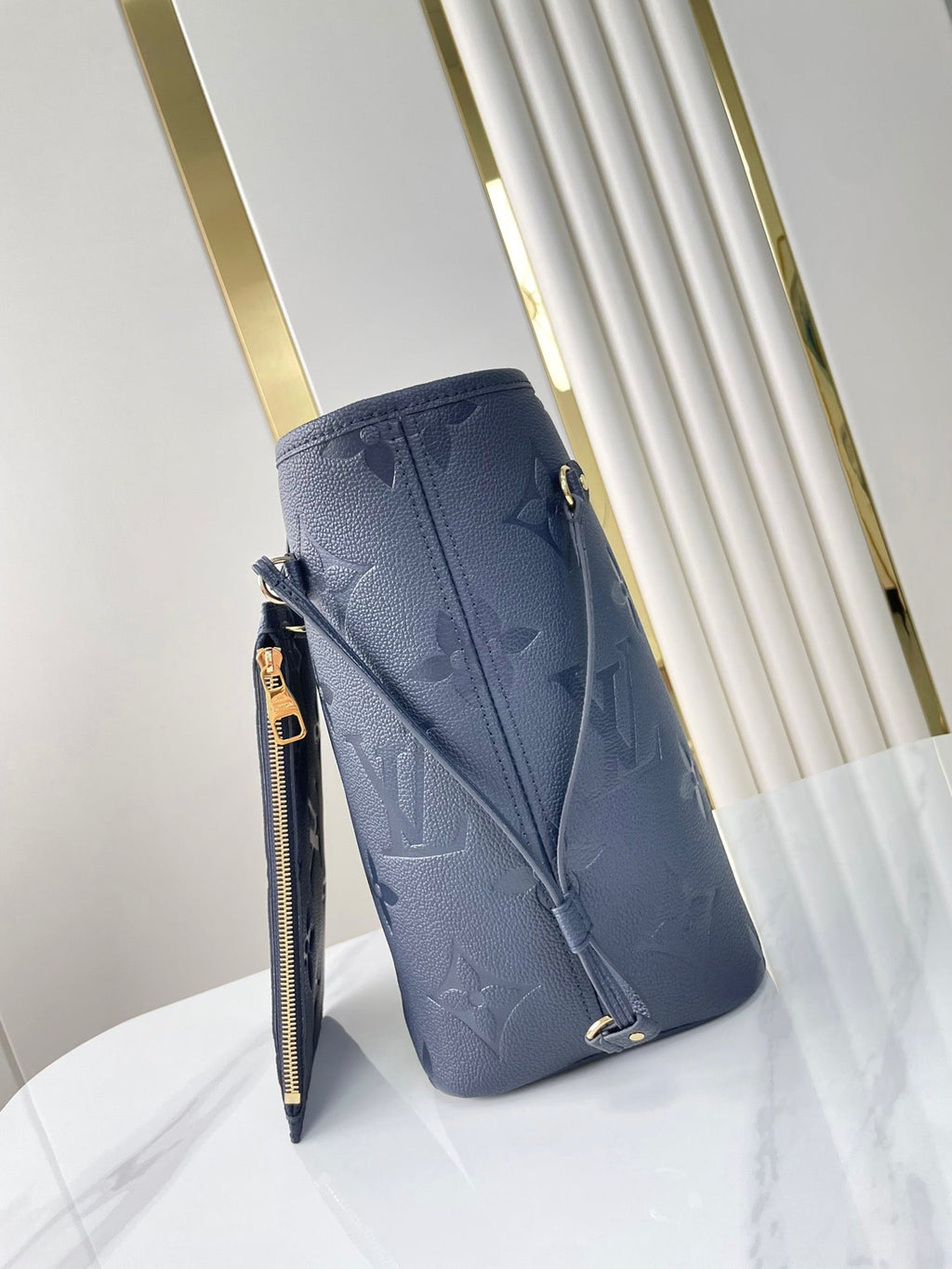 LOUIS VUITTON NEVERFULL MM 31 IN DARK NAVY MONOGRAM EMPREINTE LEATHER