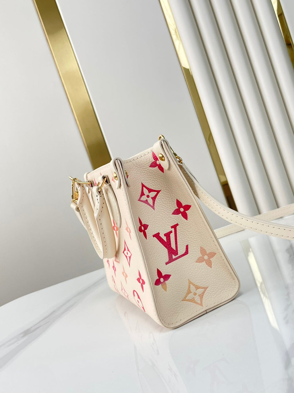 LOUIS VUITTON ONTHEGO BB 18 IN SUNRISE AQUARELLE MONOGRAM EMPREINTE LEATHER