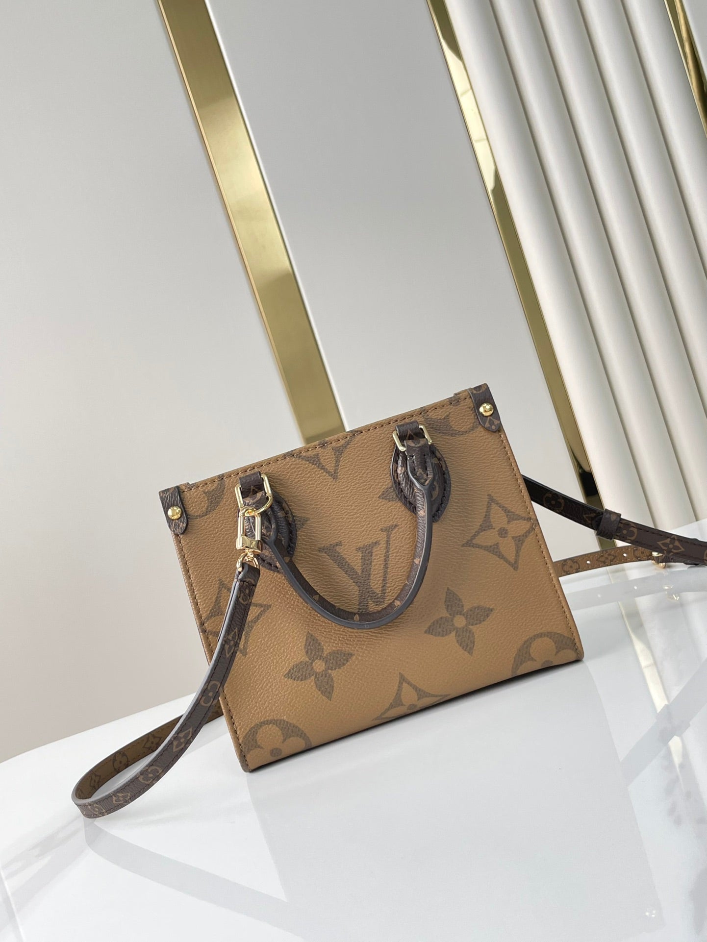 LOUIS VUITTON ONTHEGO BB 18 IN BROWN MONOGRAM AND MONOGRAM REVERSE CANVAS
