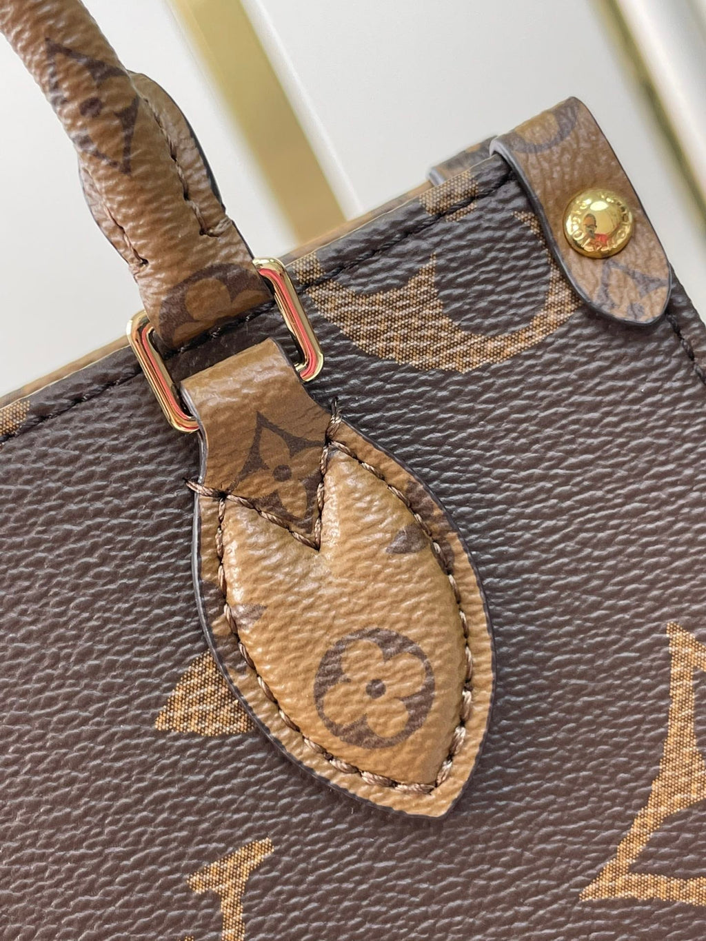 LOUIS VUITTON ONTHEGO BB 18 IN BROWN MONOGRAM AND MONOGRAM REVERSE CANVAS