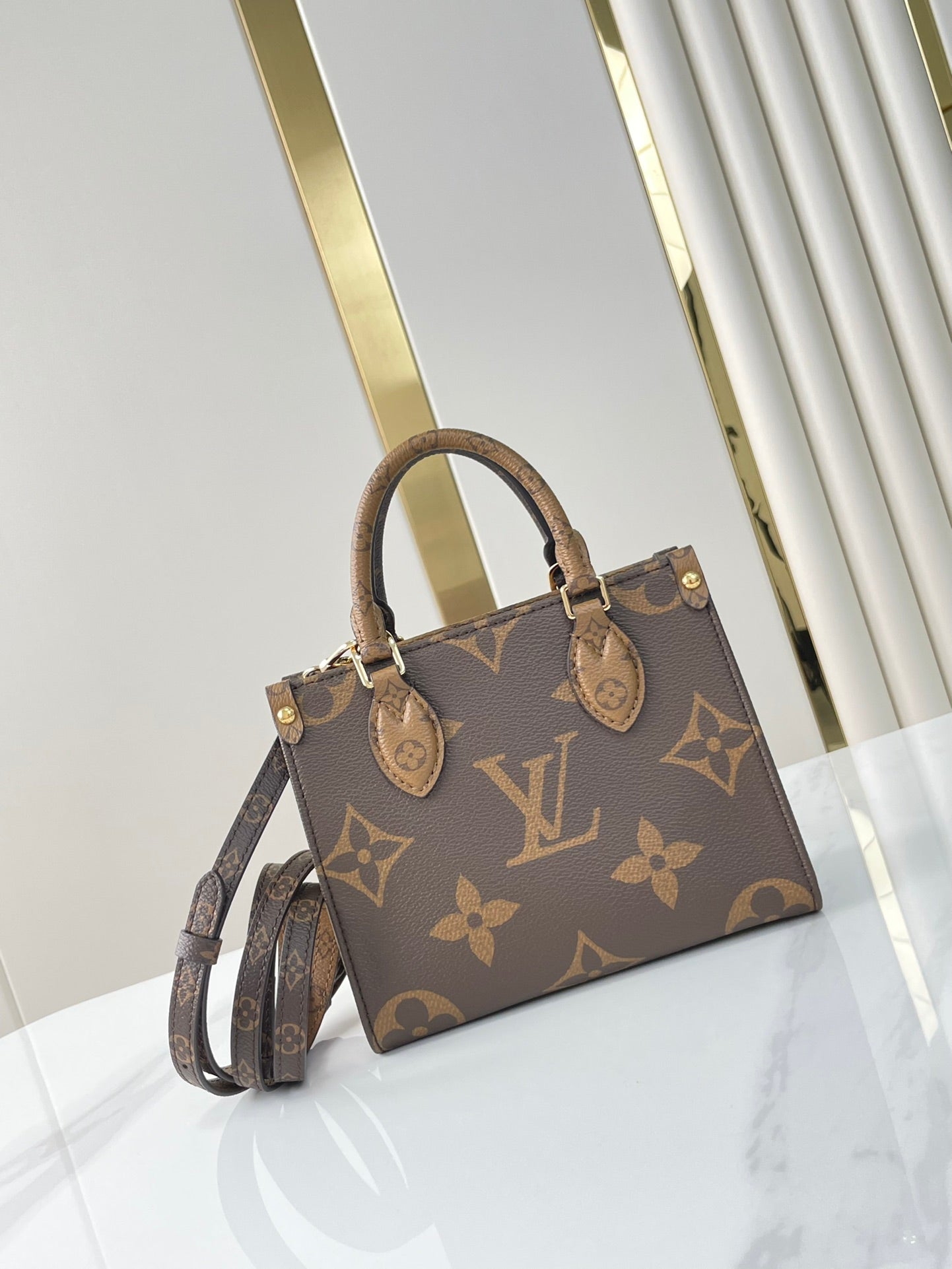 LOUIS VUITTON ONTHEGO BB 18 IN BROWN MONOGRAM AND MONOGRAM REVERSE CANVAS