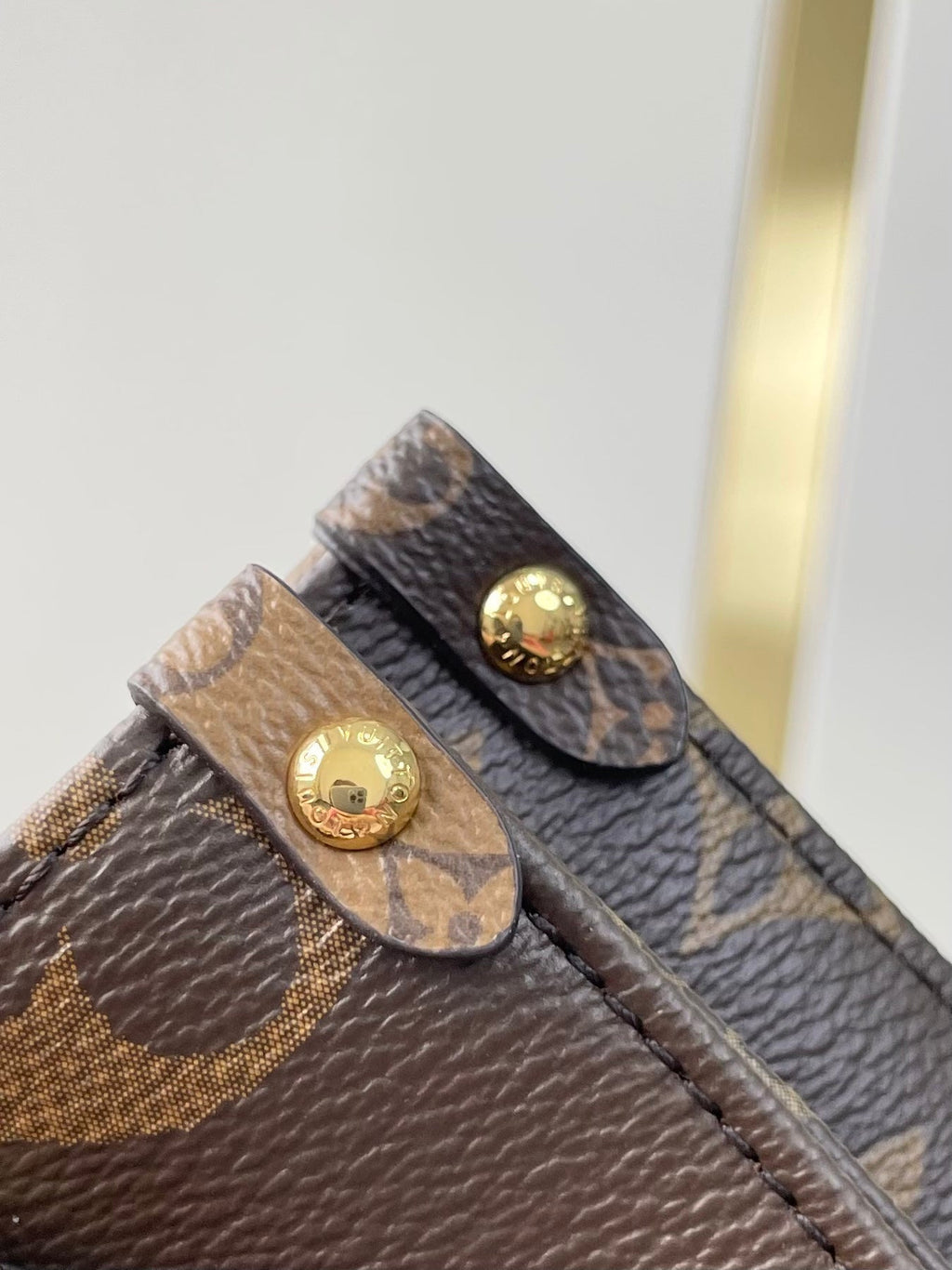 LOUIS VUITTON ONTHEGO BB 18 IN BROWN MONOGRAM AND MONOGRAM REVERSE CANVAS