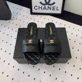CHANEL SLIPPERS IN BLACK CALFSKIN