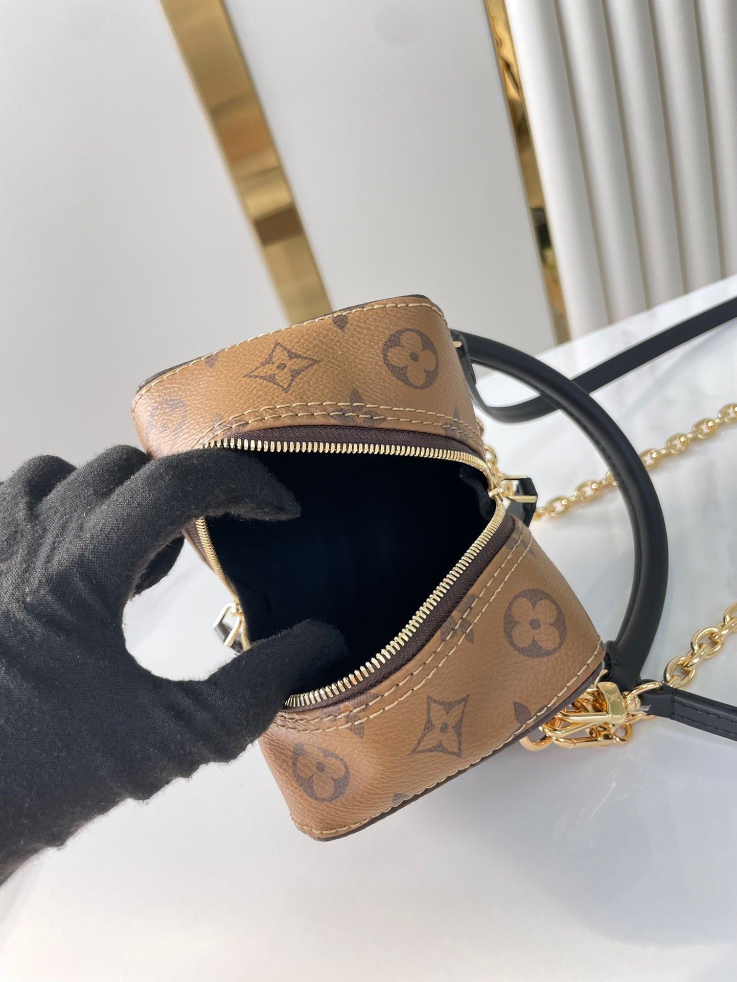 LOUIS VUITTON DICE 9 IN BROWN MONOGRAM AND MONOGRAM REVERSE CANVAS GOLD HARDWARE